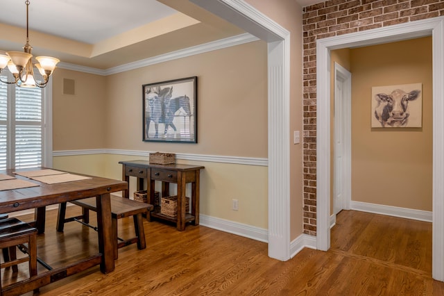 2609 Idlewood Dr, Lexington, KY 40513 - dining space with a chandelier, wood finished floors, and a tray ceiling