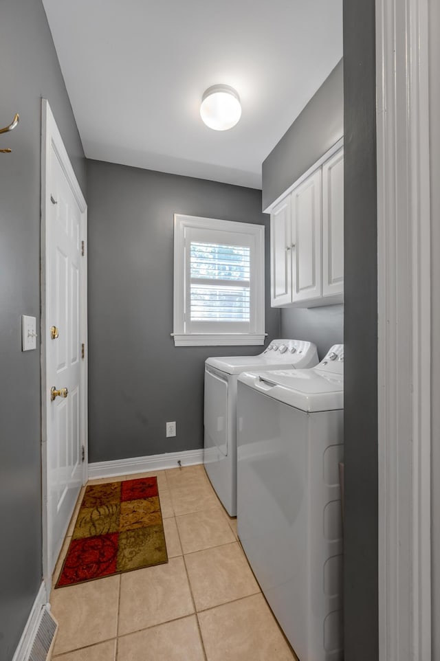 2609 Idlewood Dr, Lexington, KY 40513 - laundry room featuring cabinet space, washing machine and clothes dryer, and light tile patterned floors