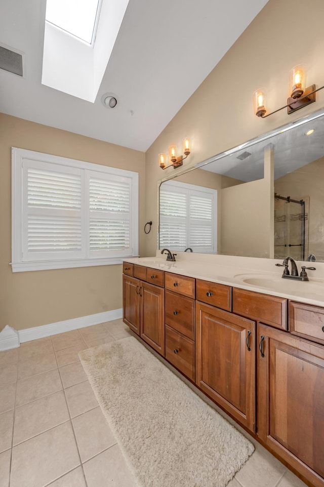 2609 Idlewood Dr, Lexington, KY 40513 - full bath with lofted ceiling, a skylight, double vanity, tile patterned floors, and a shower with shower door