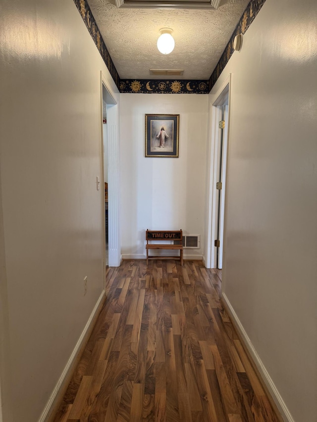 208 Secretariat Dr, Lawrenceburg, KY 40342 - hallway featuring dark wood-style flooring and a textured ceiling