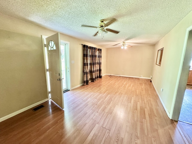 21 Herb Neal Rd, Pine Knot, KY 42635 - empty room featuring ceiling fan, light wood finished floors, and a textured ceiling