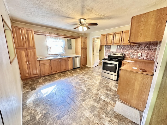 21 Herb Neal Rd, Pine Knot, KY 42635 - kitchen featuring stainless steel appliances, electric panel, a textured ceiling, ceiling fan, and light countertops
