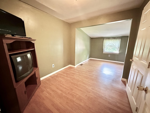 21 Herb Neal Rd, Pine Knot, KY 42635 - unfurnished living room featuring wood finished floors and baseboards