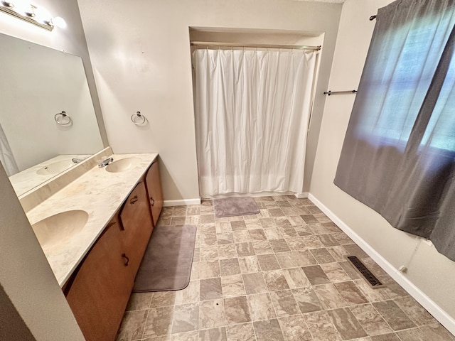 21 Herb Neal Rd, Pine Knot, KY 42635 - bathroom with double vanity, stone finish flooring, and a shower with curtain