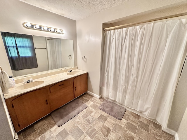 21 Herb Neal Rd, Pine Knot, KY 42635 - full bath with double vanity, a textured ceiling, stone finish flooring, and curtained shower