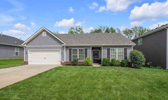 117 Mcafee Dr, Nicholasville, KY 40356 - view of front of property featuring a front lawn, concrete driveway, a garage, and a shingled roof