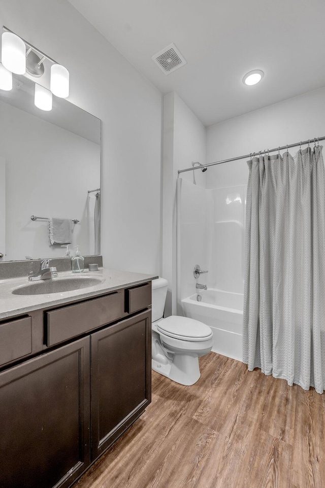 117 Mcafee Dr, Nicholasville, KY 40356 - full bathroom featuring vanity, wood finished floors, and shower / bath combo