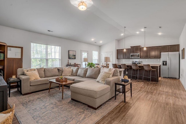 117 Mcafee Dr, Nicholasville, KY 40356 - living room with wood finished floors, lofted ceiling, and recessed lighting