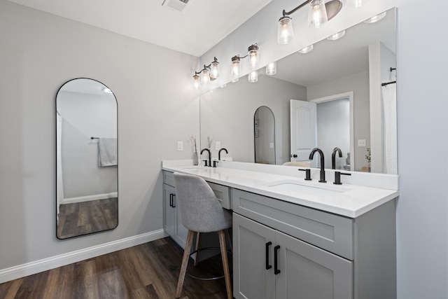 309 Memory Ln, Richmond, KY 40475 - full bathroom with double vanity and wood finished floors