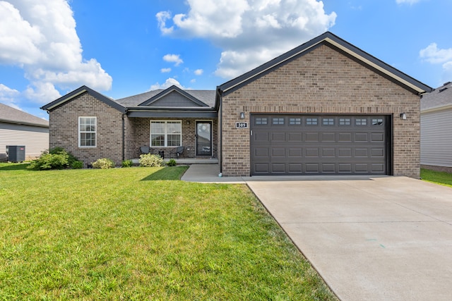 309 Memory Ln, Richmond, KY 40475 - ranch-style house with brick siding, concrete driveway, a front lawn, and a garage