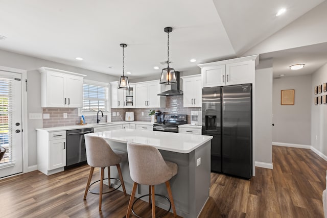 309 Memory Ln, Richmond, KY 40475 - kitchen with stainless steel appliances, wall chimney exhaust hood, tasteful backsplash, a kitchen island, and recessed lighting