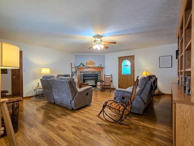 1445 Bastin Creek Rd, Kings Mountain, KY 40442 - living room featuring a ceiling fan, wood finished floors, and a fireplace