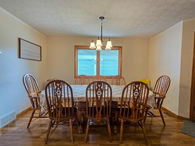 1445 Bastin Creek Rd, Kings Mountain, KY 40442 - dining area featuring crown molding, a chandelier, a textured ceiling, and wood finished floors