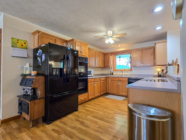 1445 Bastin Creek Rd, Kings Mountain, KY 40442 - kitchen featuring black appliances, light wood-style floors, a ceiling fan, brown cabinetry, and recessed lighting