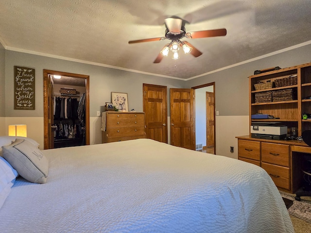 1445 Bastin Creek Rd, Kings Mountain, KY 40442 - bedroom with ornamental molding, a spacious closet, ceiling fan, and a closet