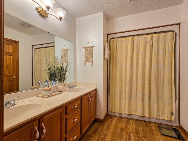 1445 Bastin Creek Rd, Kings Mountain, KY 40442 - bathroom featuring wood finished floors, double vanity, and shower / bathtub combination with curtain