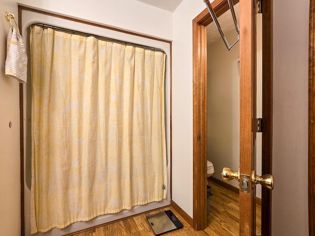 1445 Bastin Creek Rd, Kings Mountain, KY 40442 - bathroom featuring wood finished floors and shower / tub combo