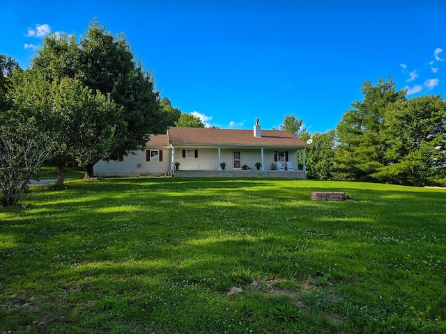 1445 Bastin Creek Rd, Kings Mountain, KY 40442 - back of property featuring a lawn, a chimney, and an outdoor fire pit