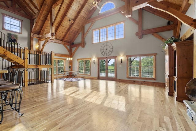 4111 Stanford Rd, Danville, KY 40422 - unfurnished living room featuring high vaulted ceiling, wood finished floors, plenty of natural light, stairs, and a wooden ceiling with exposed beams