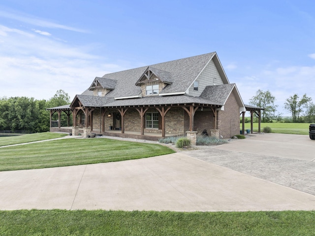 4111 Stanford Rd, Danville, KY 40422 - farmhouse with covered porch, a front lawn, a shingled roof, stone siding, and concrete driveway