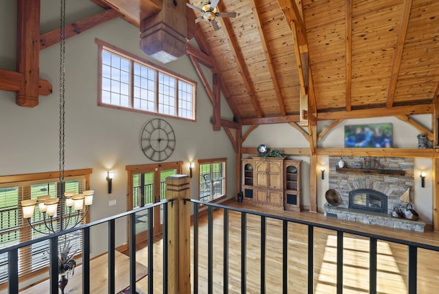4111 Stanford Rd, Danville, KY 40422 - unfurnished living room with high vaulted ceiling, a wooden ceiling with exposed beams, wood finished floors, a fireplace, and plenty of natural light