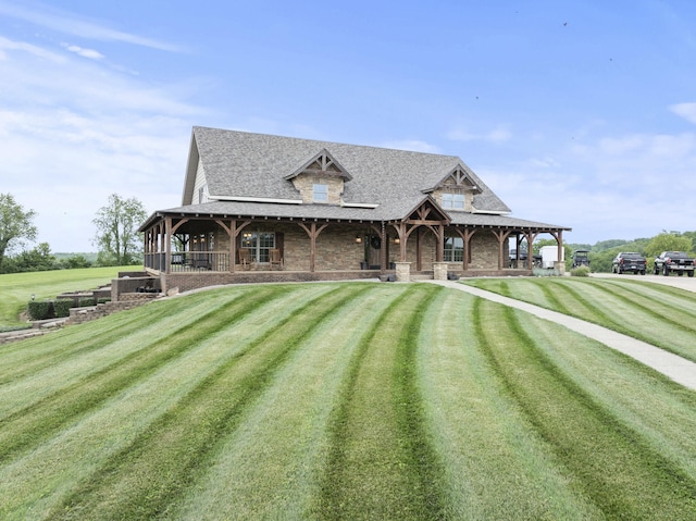 4111 Stanford Rd, Danville, KY 40422 - view of front facade featuring covered porch, a front lawn, stone siding, and a shingled roof