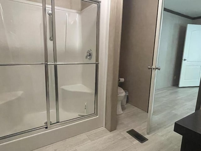 265 Jesse Sears Rd, Somerset, KY 42501 - bathroom with a shower stall, wood finished floors, and crown molding
