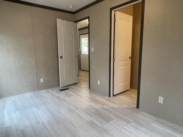 265 Jesse Sears Rd, Somerset, KY 42501 - unfurnished bedroom with light wood-type flooring and ornamental molding