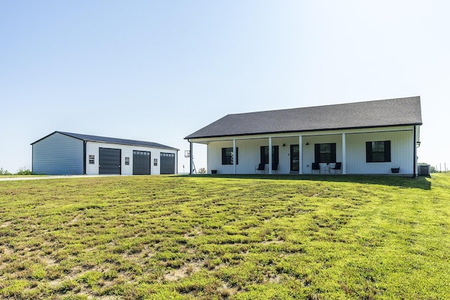 2562 High Bridge Rd, Lancaster, KY 40444 - rear view of house with a detached garage, a lawn, and an outdoor structure