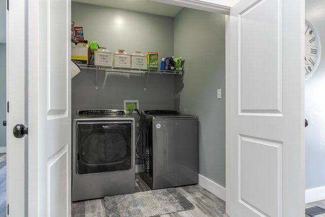 2562 High Bridge Rd, Lancaster, KY 40444 - laundry area with separate washer and dryer and wood finished floors
