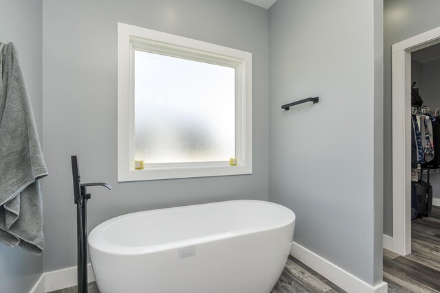 2562 High Bridge Rd, Lancaster, KY 40444 - full bath with wood finished floors, a freestanding tub, and a walk in closet