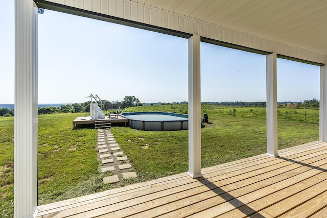 2562 High Bridge Rd, Lancaster, KY 40444 - wooden deck featuring an outdoor pool, a lawn, and a view of rural / pastoral area