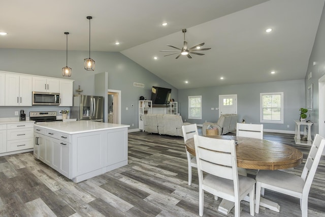 2562 High Bridge Rd, Lancaster, KY 40444 - kitchen with stainless steel appliances, a center island, high vaulted ceiling, ceiling fan, and white cabinetry