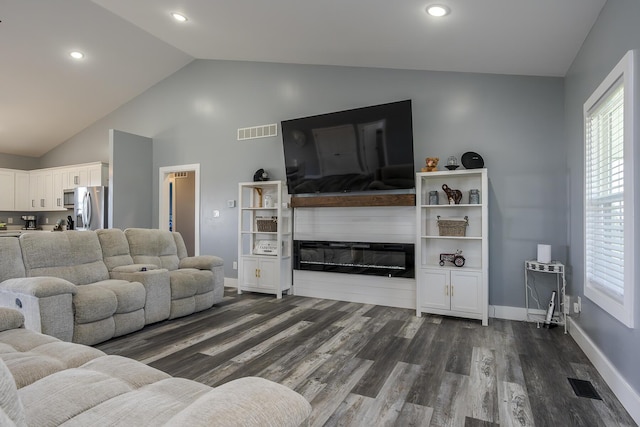 2562 High Bridge Rd, Lancaster, KY 40444 - living area with dark wood finished floors, recessed lighting, a glass covered fireplace, and high vaulted ceiling