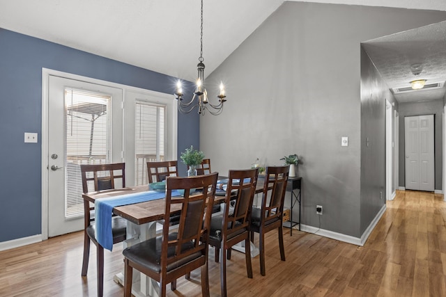 1008 Marshall Park Dr, Georgetown, KY 40324 - dining room with light wood-type flooring, lofted ceiling, and a chandelier