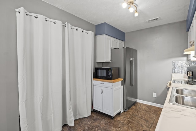 1008 Marshall Park Dr, Georgetown, KY 40324 - kitchen with black microwave, white cabinets, a textured ceiling, and wood counters