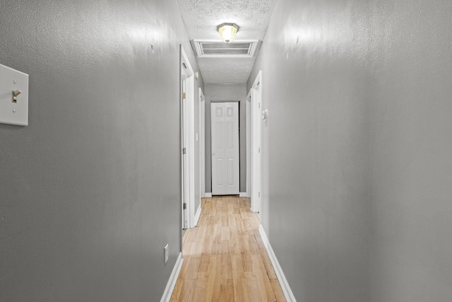 1008 Marshall Park Dr, Georgetown, KY 40324 - hall with light wood-style flooring and a textured ceiling