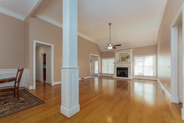168 Master Ct, Hustonville, KY 40437 - unfurnished living room with ornate columns, ceiling fan, light wood-type flooring, a fireplace with raised hearth, and crown molding