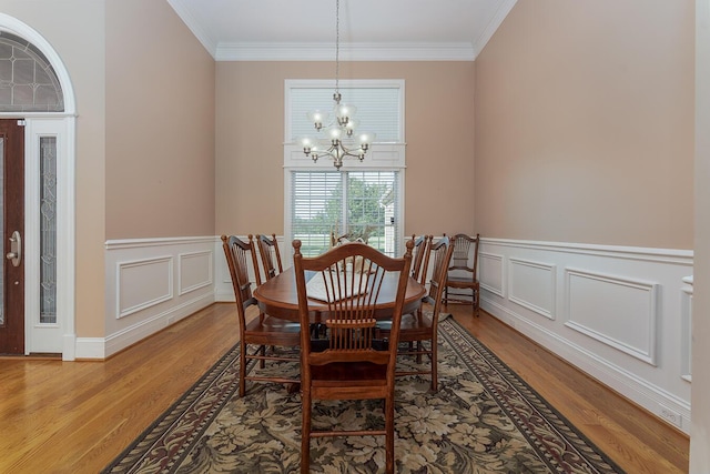 168 Master Ct, Hustonville, KY 40437 - dining area featuring a chandelier, ornamental molding, light wood-type flooring, wainscoting, and a decorative wall