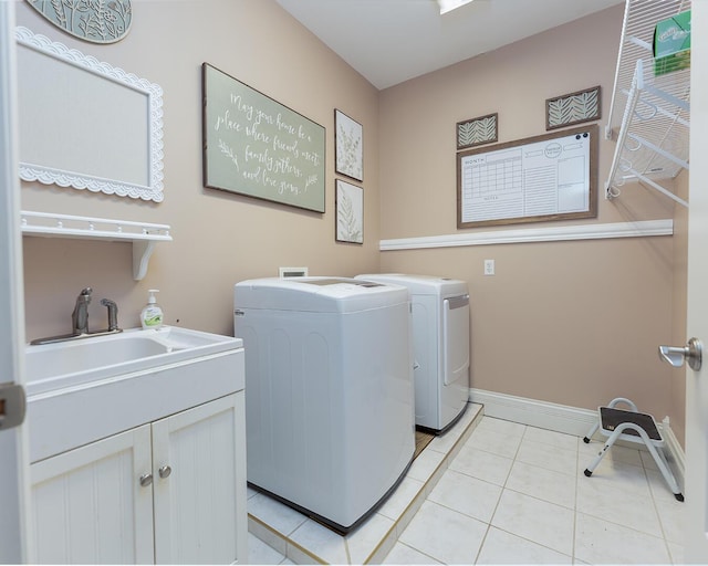 168 Master Ct, Hustonville, KY 40437 - washroom featuring washing machine and dryer, cabinet space, and light tile patterned floors