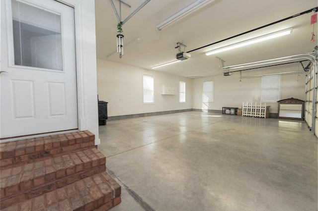 168 Master Ct, Hustonville, KY 40437 - garage featuring baseboards and a garage door opener