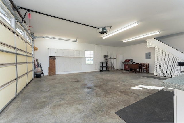 168 Master Ct, Hustonville, KY 40437 - garage with electric panel and a garage door opener