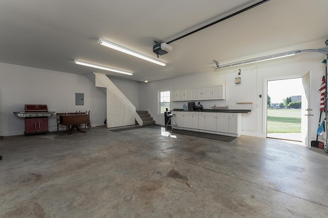 168 Master Ct, Hustonville, KY 40437 - garage with a garage door opener and electric panel