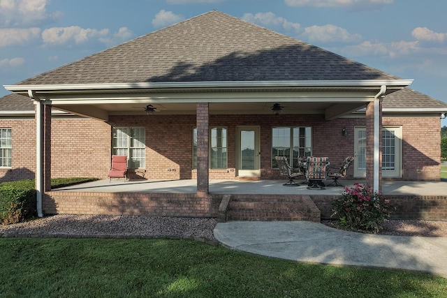 168 Master Ct, Hustonville, KY 40437 - rear view of house featuring ceiling fan, roof with shingles, brick siding, and a patio