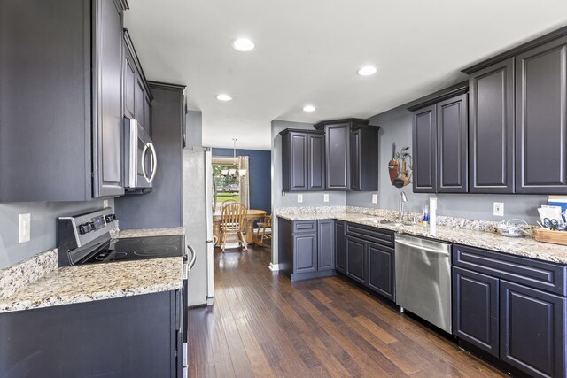 106 Louisa Ln, Georgetown, KY 40324 - kitchen with appliances with stainless steel finishes, dark wood-style floors, recessed lighting, and light stone counters