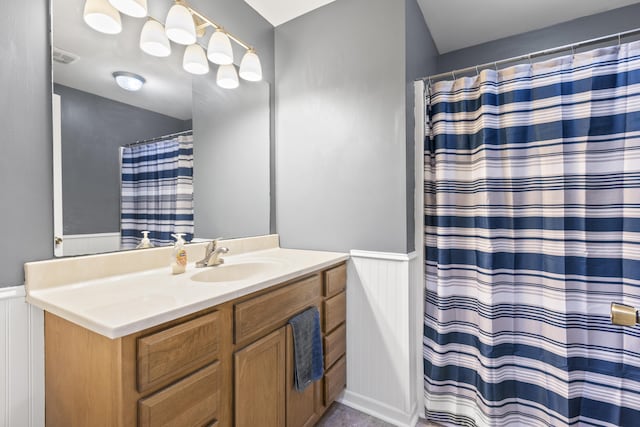 106 Louisa Ln, Georgetown, KY 40324 - bathroom featuring vanity, wainscoting, curtained shower, and a decorative wall