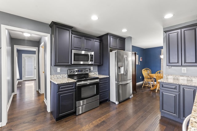 106 Louisa Ln, Georgetown, KY 40324 - kitchen featuring stainless steel appliances, dark wood finished floors, light stone counters, and recessed lighting