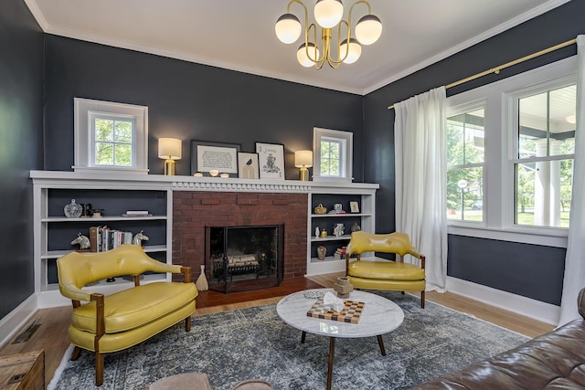 321 Center St, Berea, KY 40403 - living area featuring wood finished floors, a chandelier, ornamental molding, and a brick fireplace