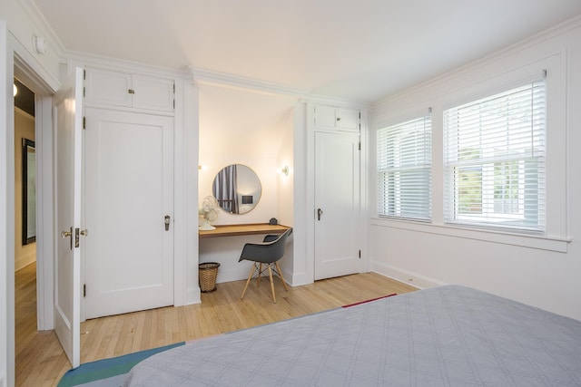 321 Center St, Berea, KY 40403 - bedroom featuring light wood-style flooring, crown molding, and built in desk