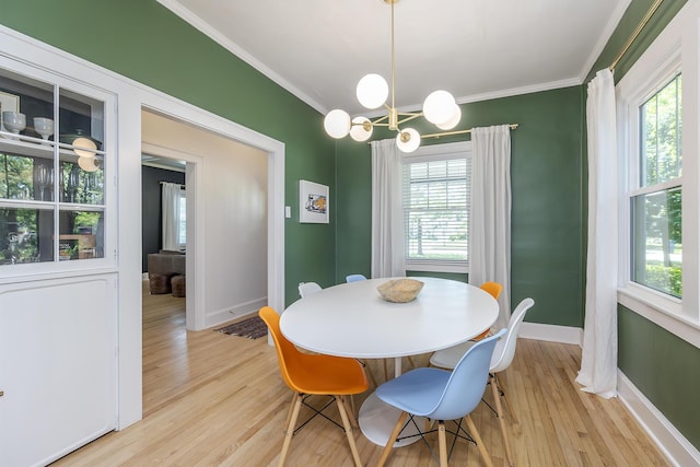 321 Center St, Berea, KY 40403 - dining area featuring crown molding, light wood-type flooring, plenty of natural light, and a chandelier